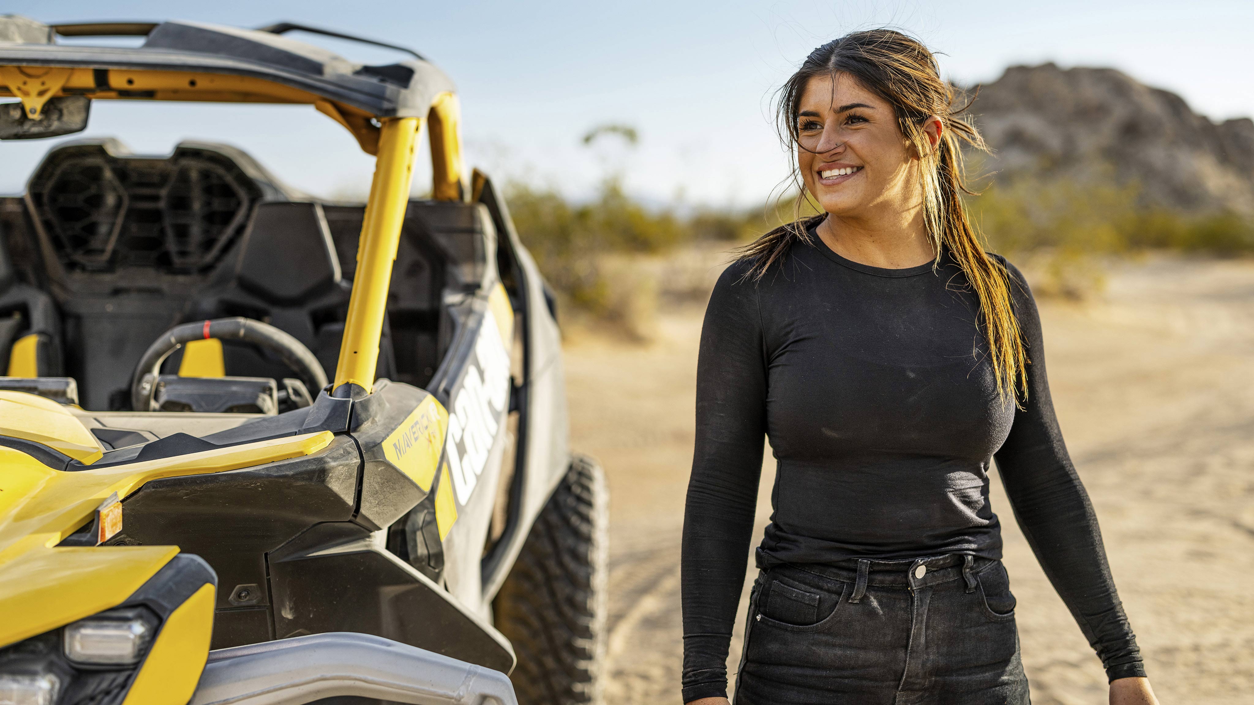 Can-Am ambassador next the Maverick R in the middle of the desert