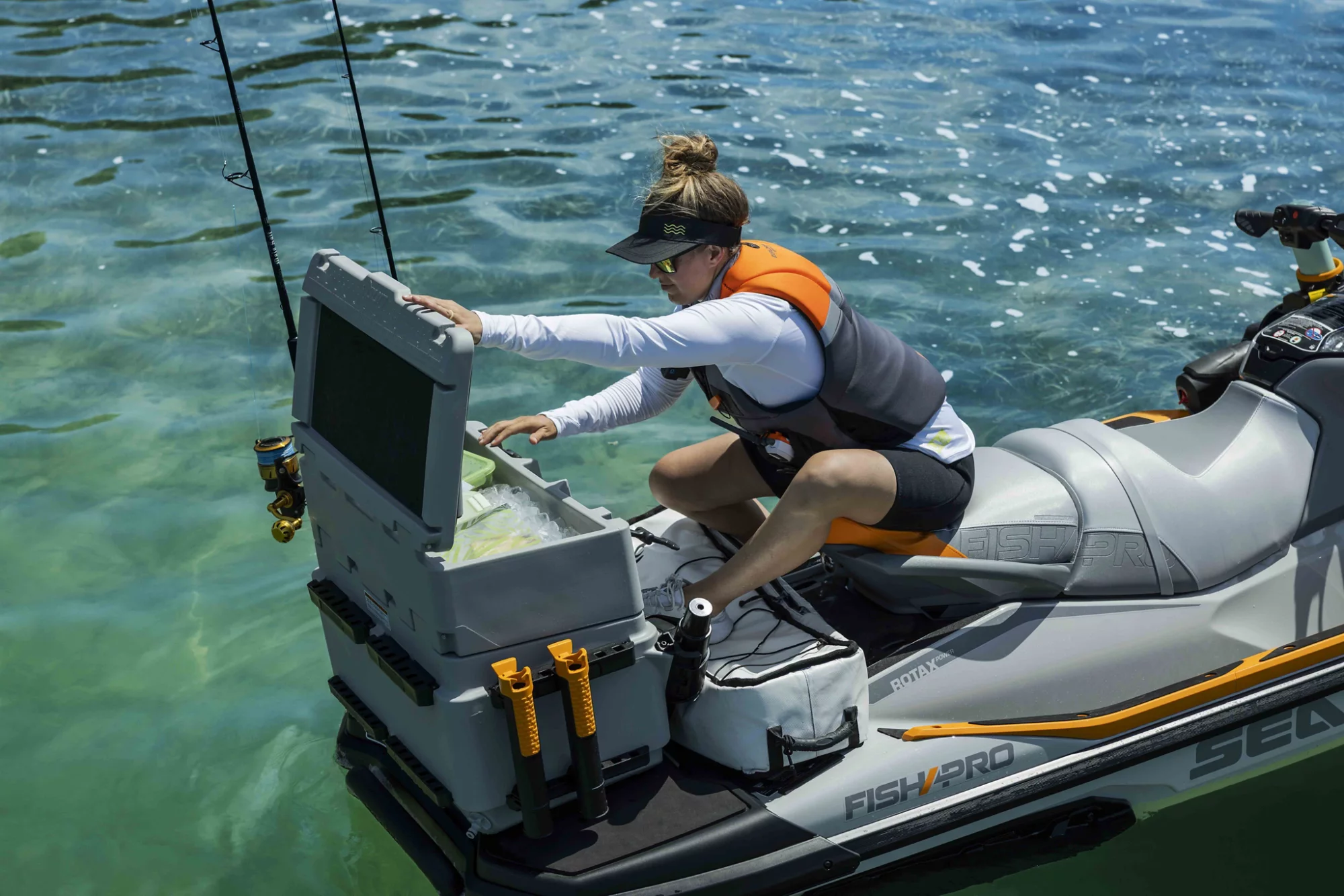 Men adding a freshly catch fish in a LinQ cooler