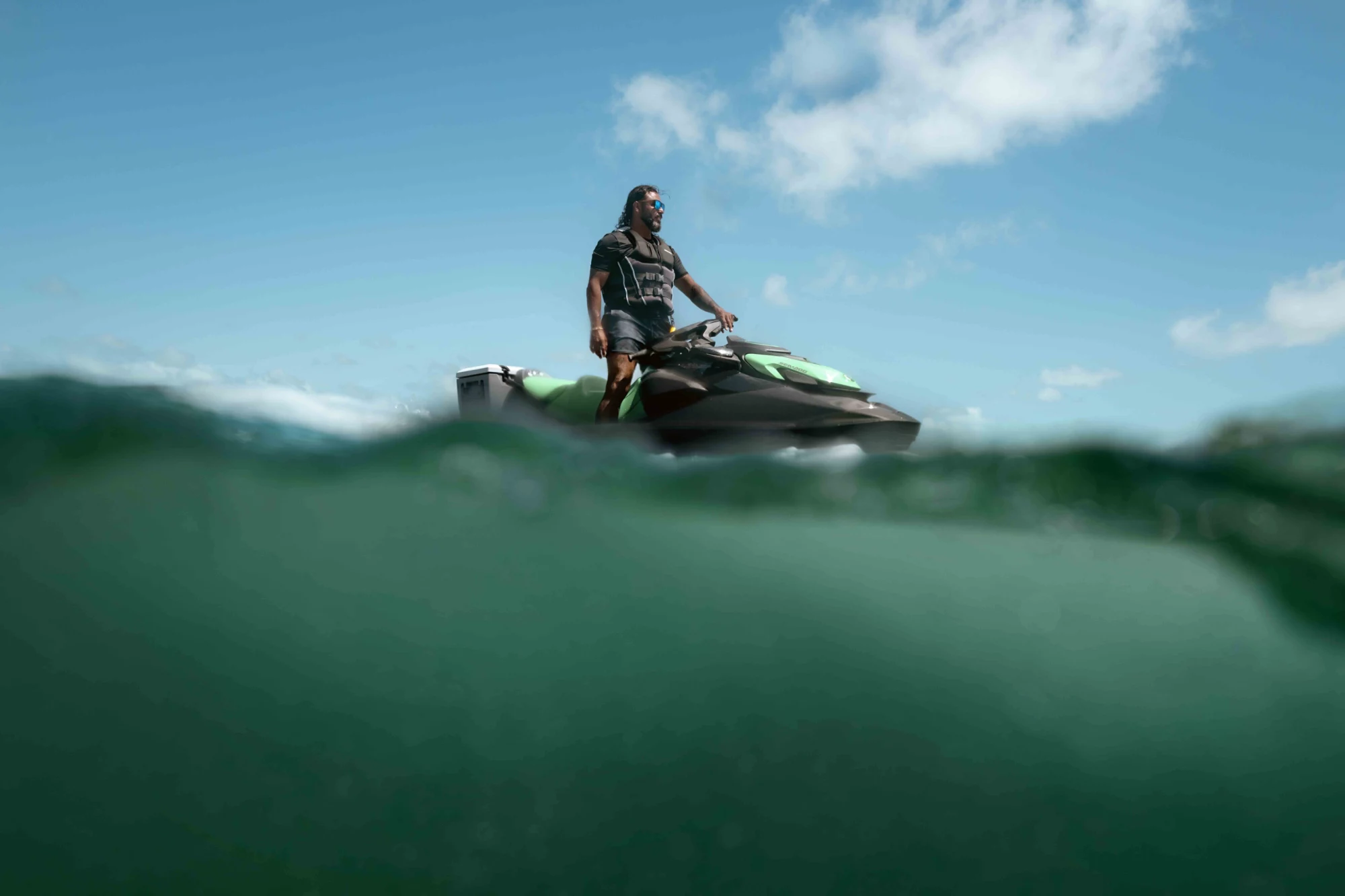 A man standing on his 2026 Sea-Doo GTI SE watercraft