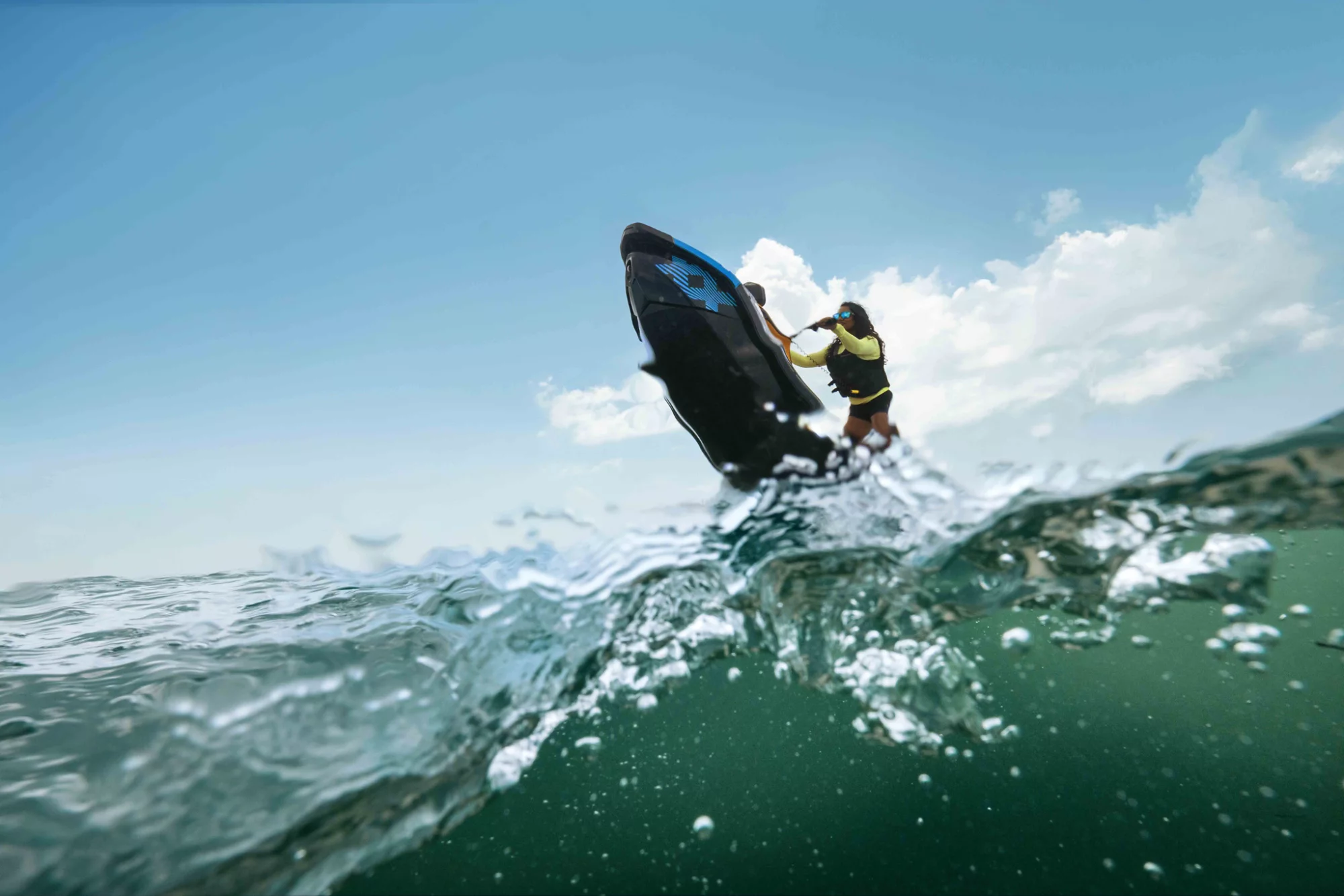 A woman performing tricks on her Sea-Doo Spark 2026 personal watercraft
