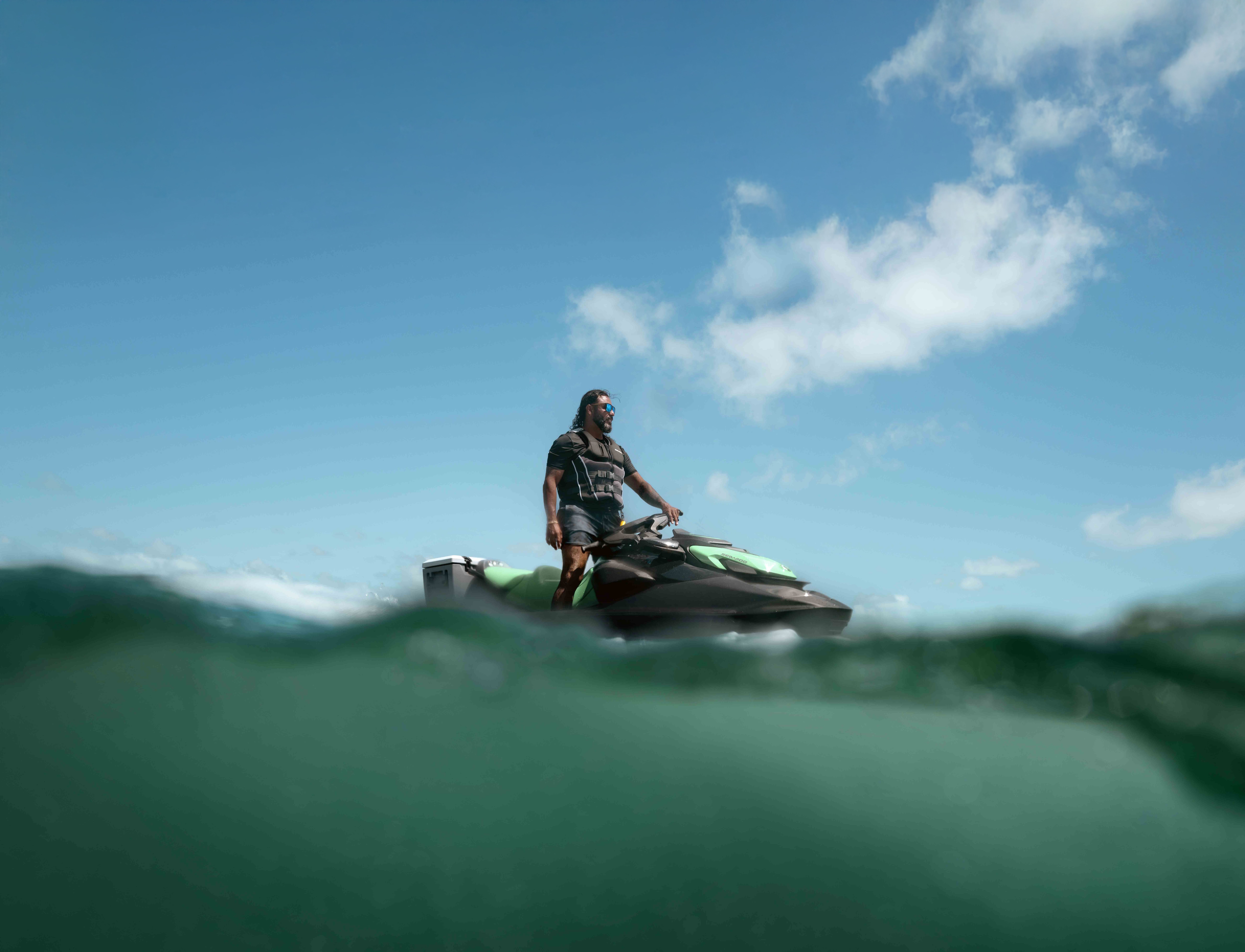 A man standing on his 2026 Sea-Doo GTI SE watercraft